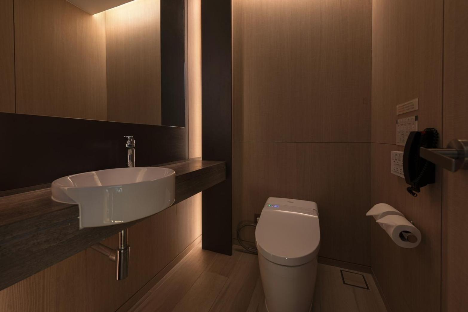 Mu Jiaoxi Hotel Exterior foto A modern bathroom